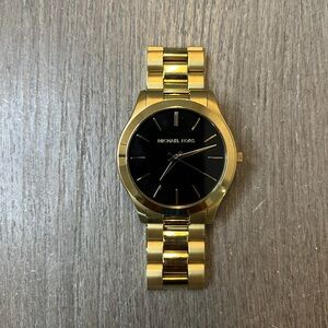 Men’s gold Michael Kors watch